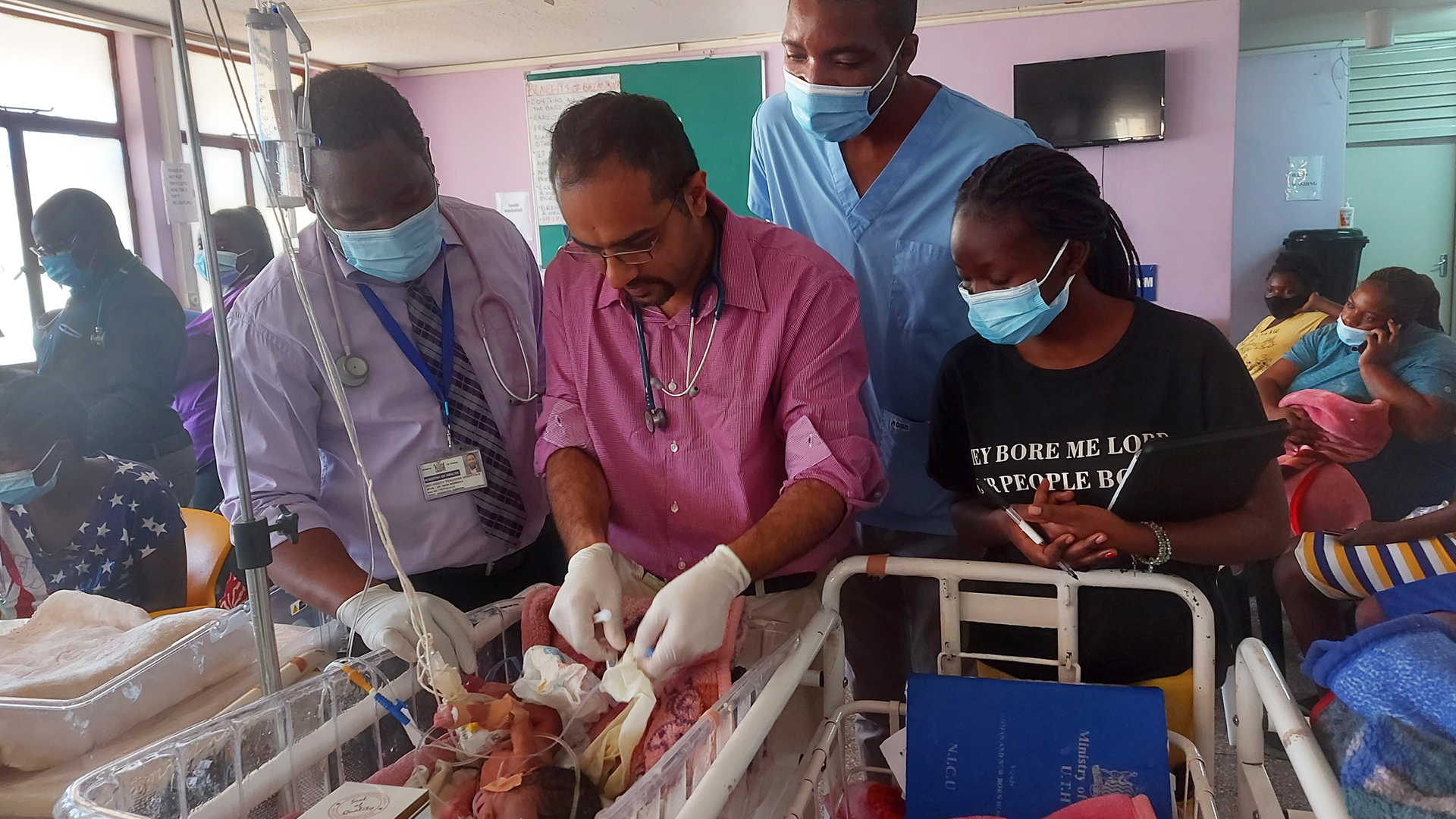 Paediatric surgeons treating an infant